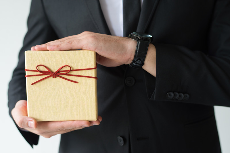 Man holding a corporate gift